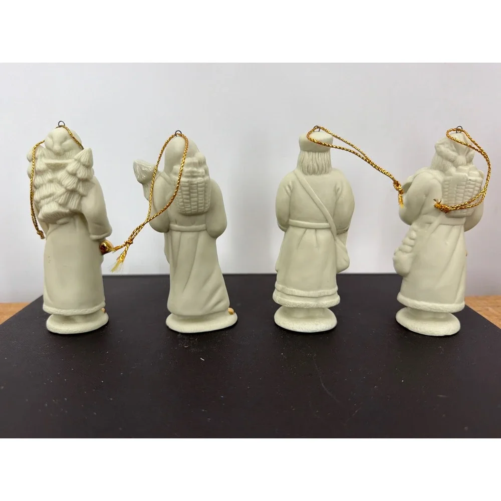 Set of 4 Vintage Bisque Porcelain Santa Claus Figurines Gold Accents Ornaments